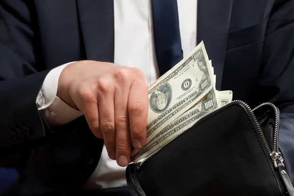 Businessman with money in hands. — Stock Photo, Image