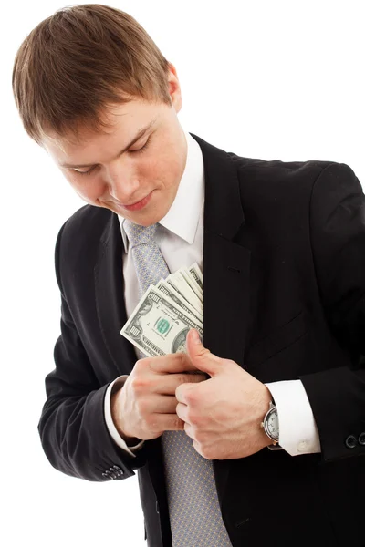 Man in een brengen geld in zijn zak. — Stockfoto