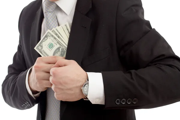 Άνθρωπος στην μια βάζοντας χρήματα στην τσέπη του. — Φωτογραφία Αρχείου