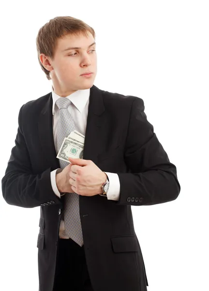 Άνθρωπος στην μια βάζοντας χρήματα στην τσέπη του. — Φωτογραφία Αρχείου
