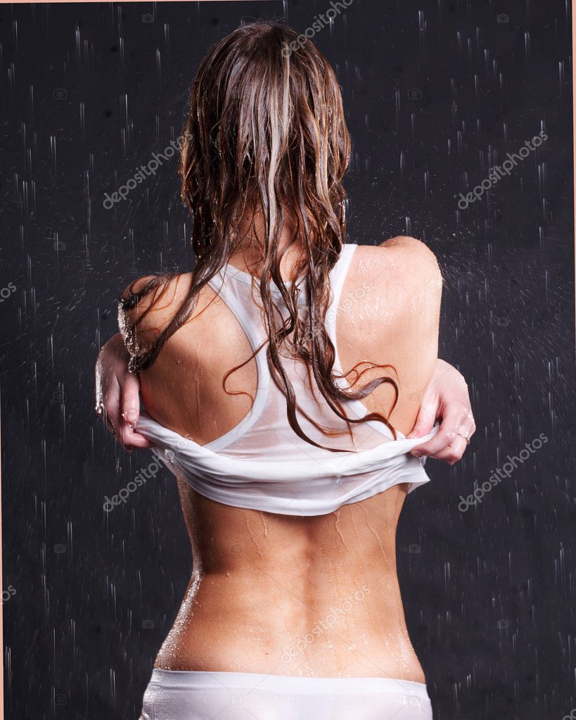Woman taking off t-shirt.