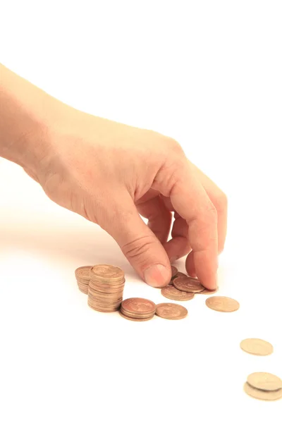 Hand met munt en geld trap geïsoleerd op witte achtergrond — Stockfoto