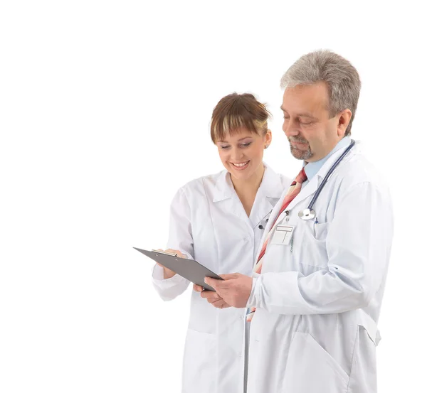 Happy smiling mature doctor with assistant — Stock Photo, Image