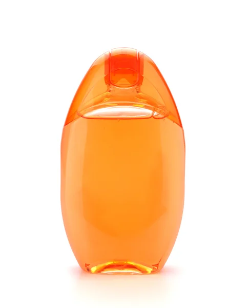 Помаранчевий шампунь пляшка — стокове фото