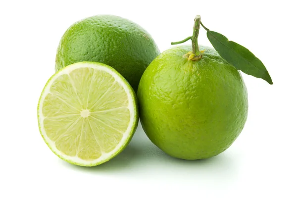 Ripe limes with green leaf — Stock Photo, Image