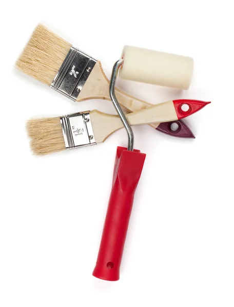 Two paintbrushes and roller — Stock Photo, Image