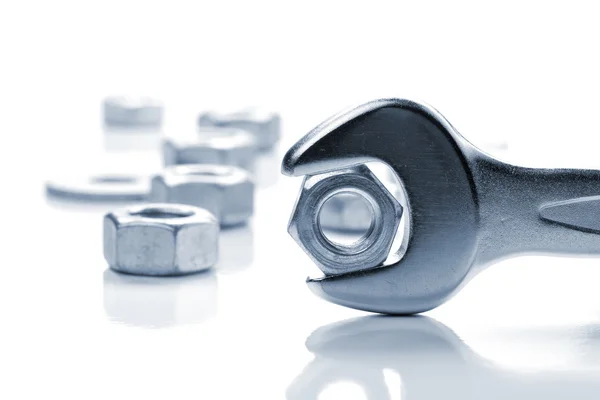Metal nut in spanner — Stock Photo, Image