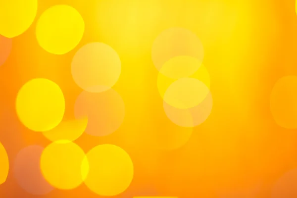 Abstract sunny bokeh on orange — Stock Photo, Image