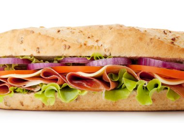 Long sandwich with ham, cheese, tomatoes, red onion and lettuce. Closeup, isolated on white. clipart