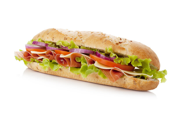 Long sandwich with ham, cheese, tomatoes, red onion and lettuce. Isolated on white