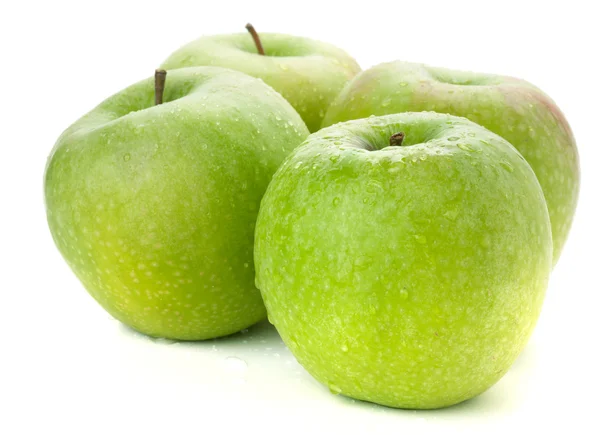 Fyra mogna gröna äpplen — Stockfoto