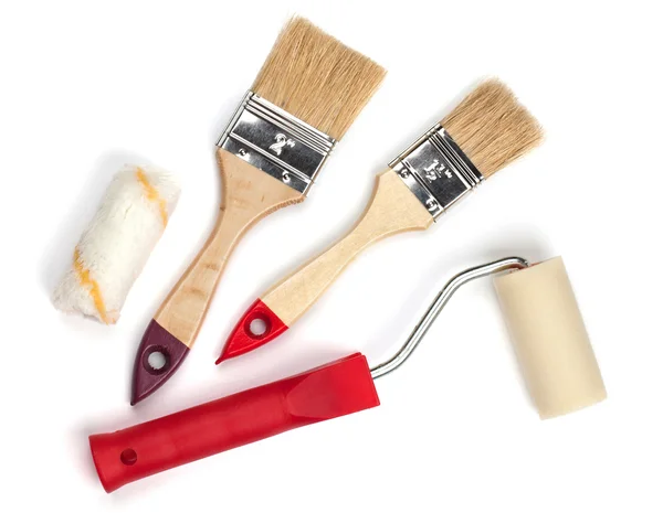 Two paintbrushes and roller — Stock Photo, Image