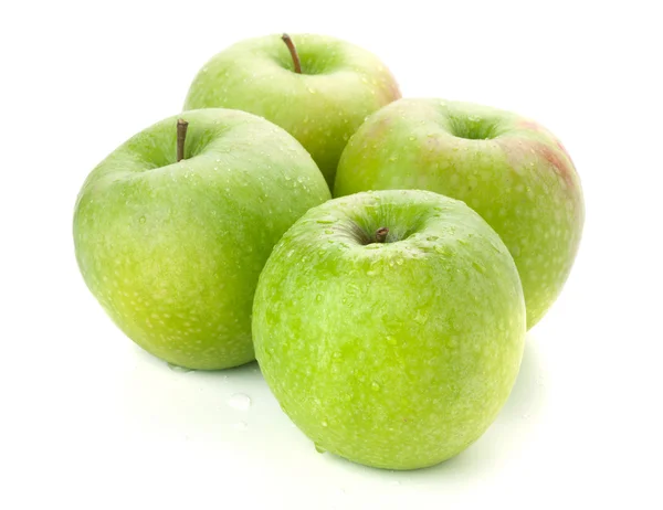 Fyra mogna gröna äpplen — Stockfoto