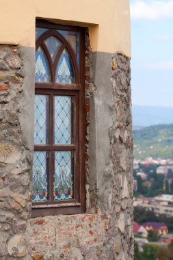 The antique window in old stone wall clipart