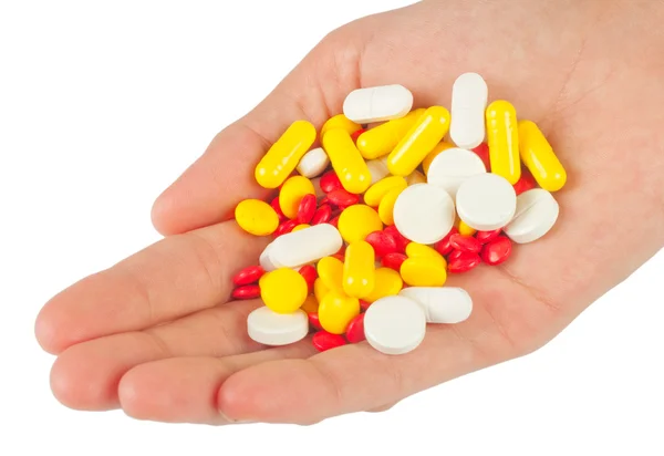 Tabletták egy leosztásban, fehér háttér — Stock Fotó