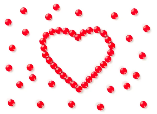 Tabletki w kształcie serca, na białym tle — Zdjęcie stockowe