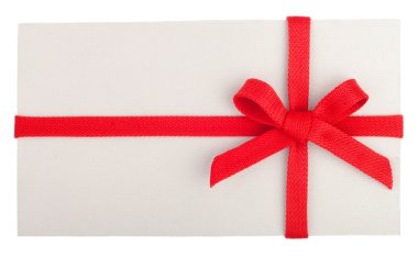 Blank gift or letter with a red bow isolated on white clipart