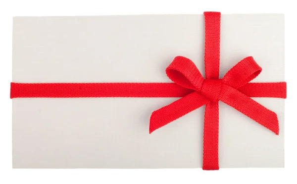 Blank gift or letter with a red bow isolated on white — Stock Photo, Image