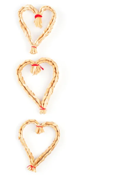 Jul strawy dekorativa hjärtan isolerad på vit — Stockfoto