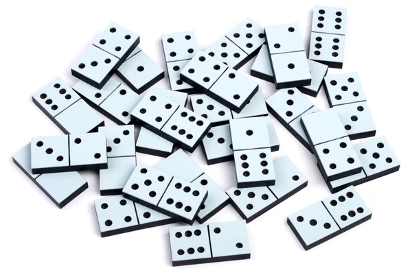 Domino kousků, kterým se na bílém pozadí náhodně — Stock fotografie