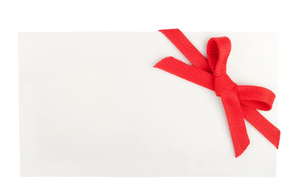 Rode strik op een lege witte doos geïsoleerd op wit — Stockfoto