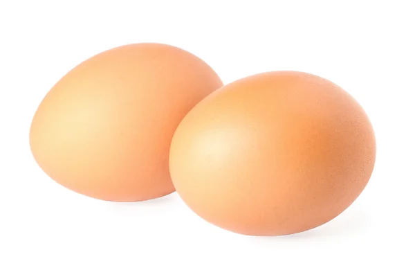 Deux œufs bruns isolés sur fond blanc — Photo