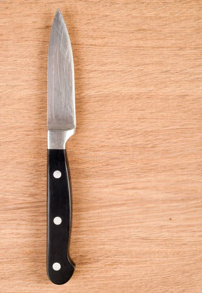 stock image Knife on a wooden background