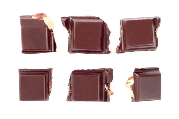 Pezzi su noci cioccolato isolato su sfondo bianco — Foto Stock