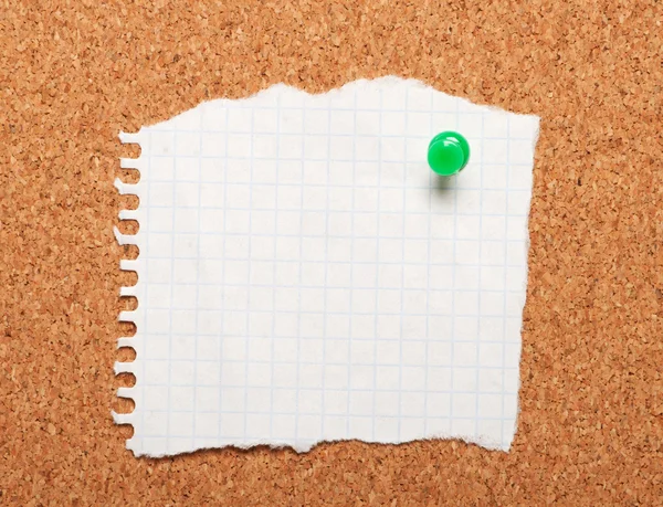 Closeup of piece of paper on a cork board — Stock Photo, Image
