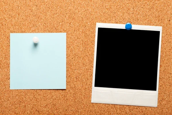 Blank instant photo and note paper on a cork board — Stock Photo, Image