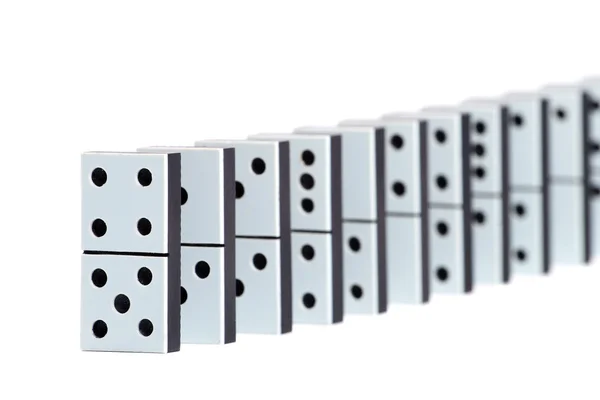 Domino pieces in a line on white background — Stock Photo, Image