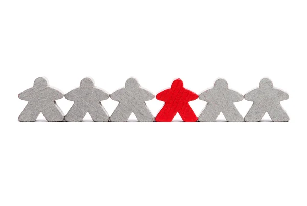 Rote Figur unter den Grauen als Symbol der Differenz oder Führung — Stockfoto