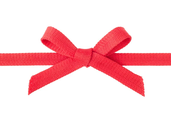 Красная лента с луком, изолированным на белом — стоковое фото