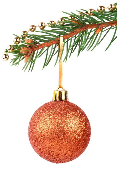 Golden bauble on a Christmas tree branch — Stock Photo, Image