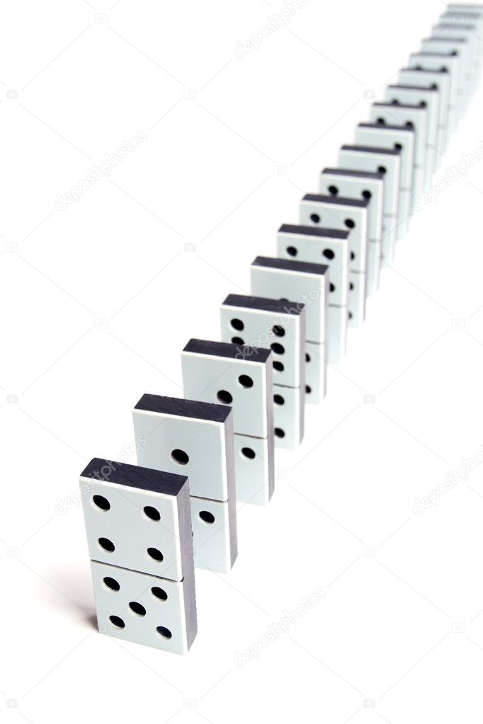 Dominoes in a line on white background