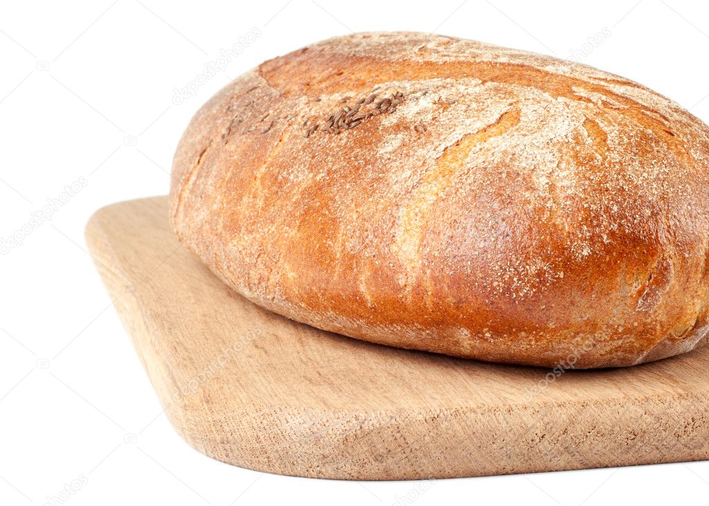 Loaf of bread on a cutting board isolated on white