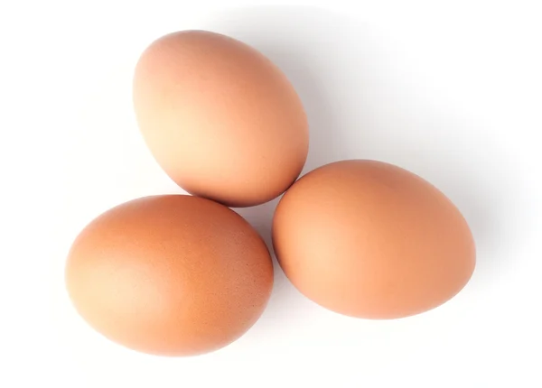 Three brown eggs on white background — Stock Photo, Image