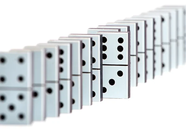 Domino pieces in a line on white background — Stock Photo, Image