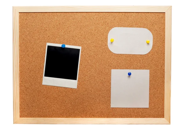 Blank instant photo and note papers on a cork board — Stock Photo, Image