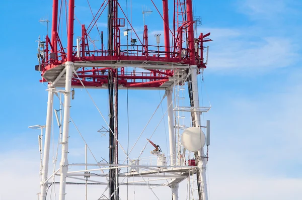 stock image Telecommunication tower with antennas against blue sky