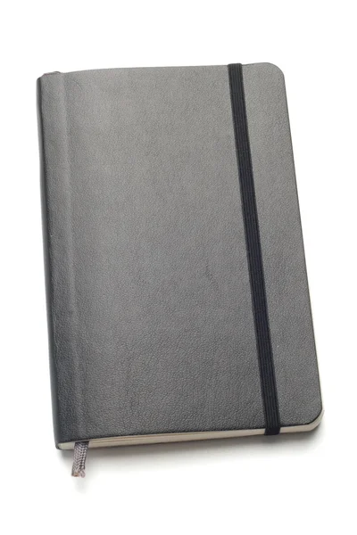 Cuaderno Moleskine negro sobre fondo blanco — Foto de Stock