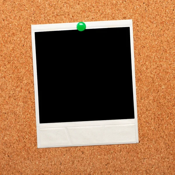 Zwarte instant foto op een cork board — Stockfoto