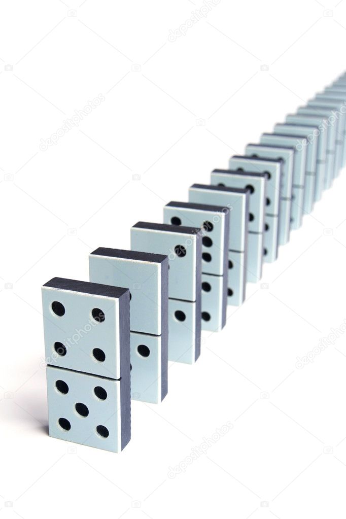 Domino pieces in a line on white background