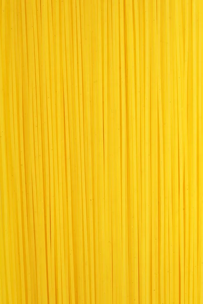 Makaron żółte tło — Zdjęcie stockowe