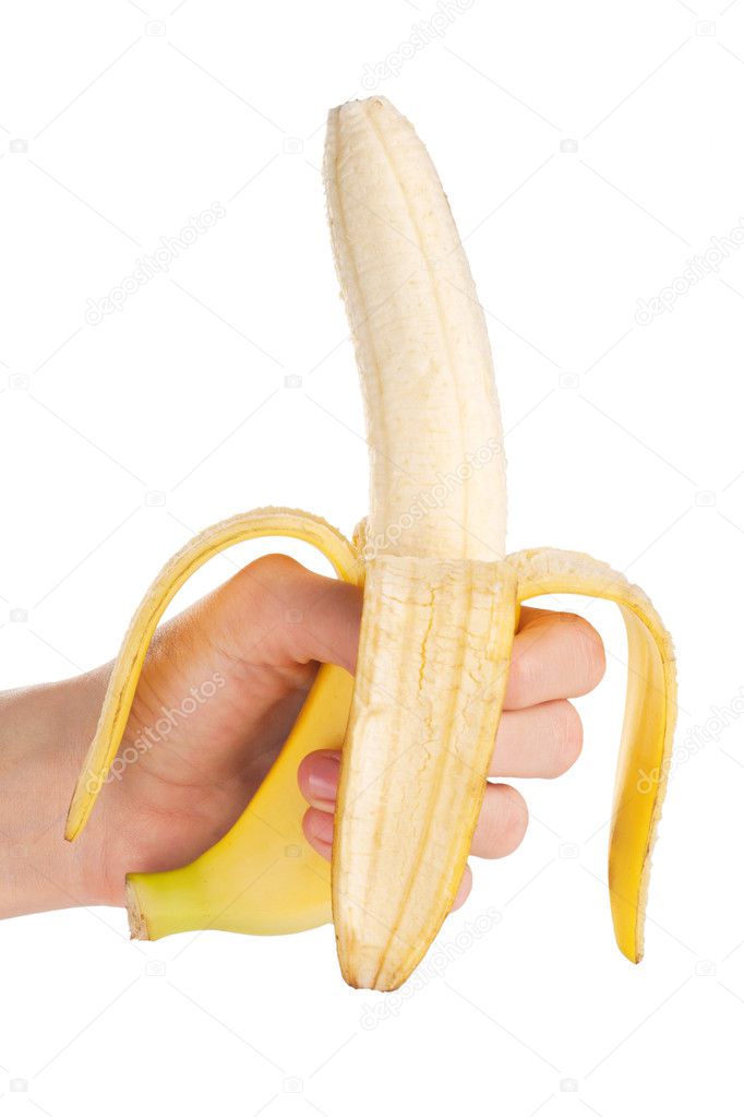 Ripe banana in the hand on white background