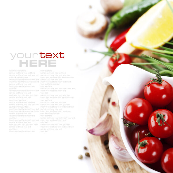 Tomatos, chives, peppers, lemon, mushrooms and garlic on white background. With sample text