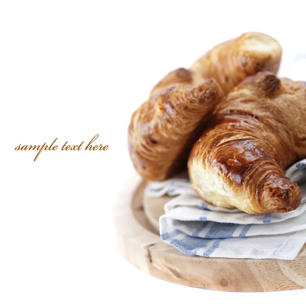 stock image Fresh croissants over white (easy removable text)