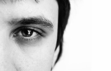 Macro shot of man's eye with visible blood vessels clipart