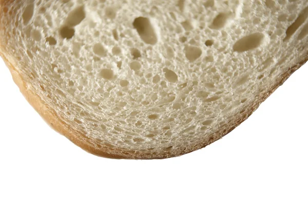 Uma única fatia de pão branco isolado em branco . — Fotografia de Stock