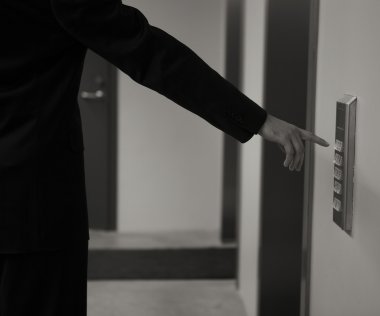 A hand inserting keycard in the electronic lock - a series of HOTEL images. clipart